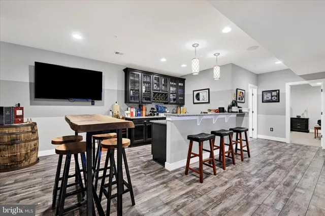 an aerial view of a house with a garden and swimming pool