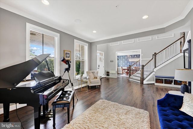 a living room with furniture fireplace and a window