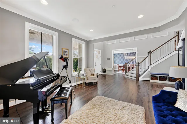 a living room with furniture fireplace and a window