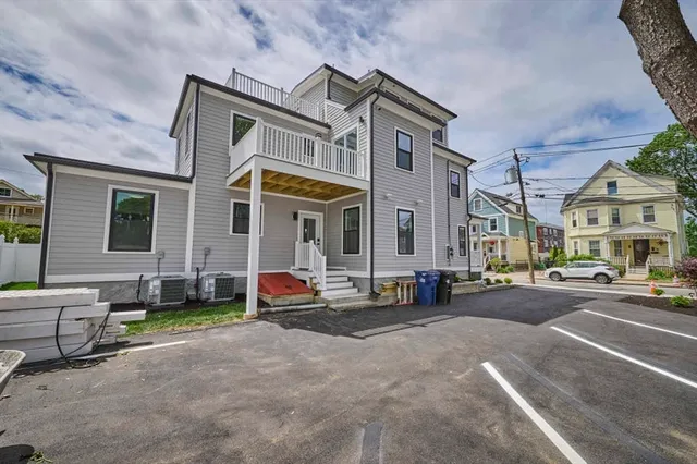 a view of a parked cars in front of a building