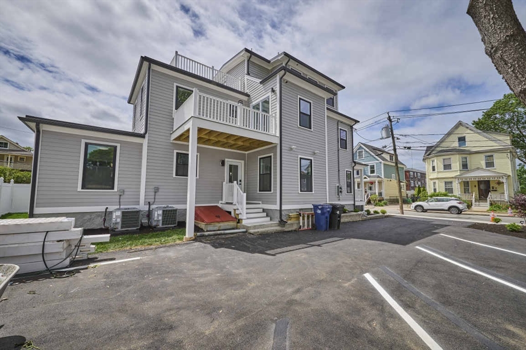 97 Oakton Avenue, Unit 1 Boston, MA 02122 - Photo 3 of 20 a view of a parked cars in front of a building