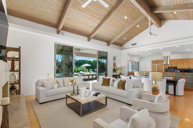 a kitchen with stainless steel appliances granite countertop a sink and a wooden floors