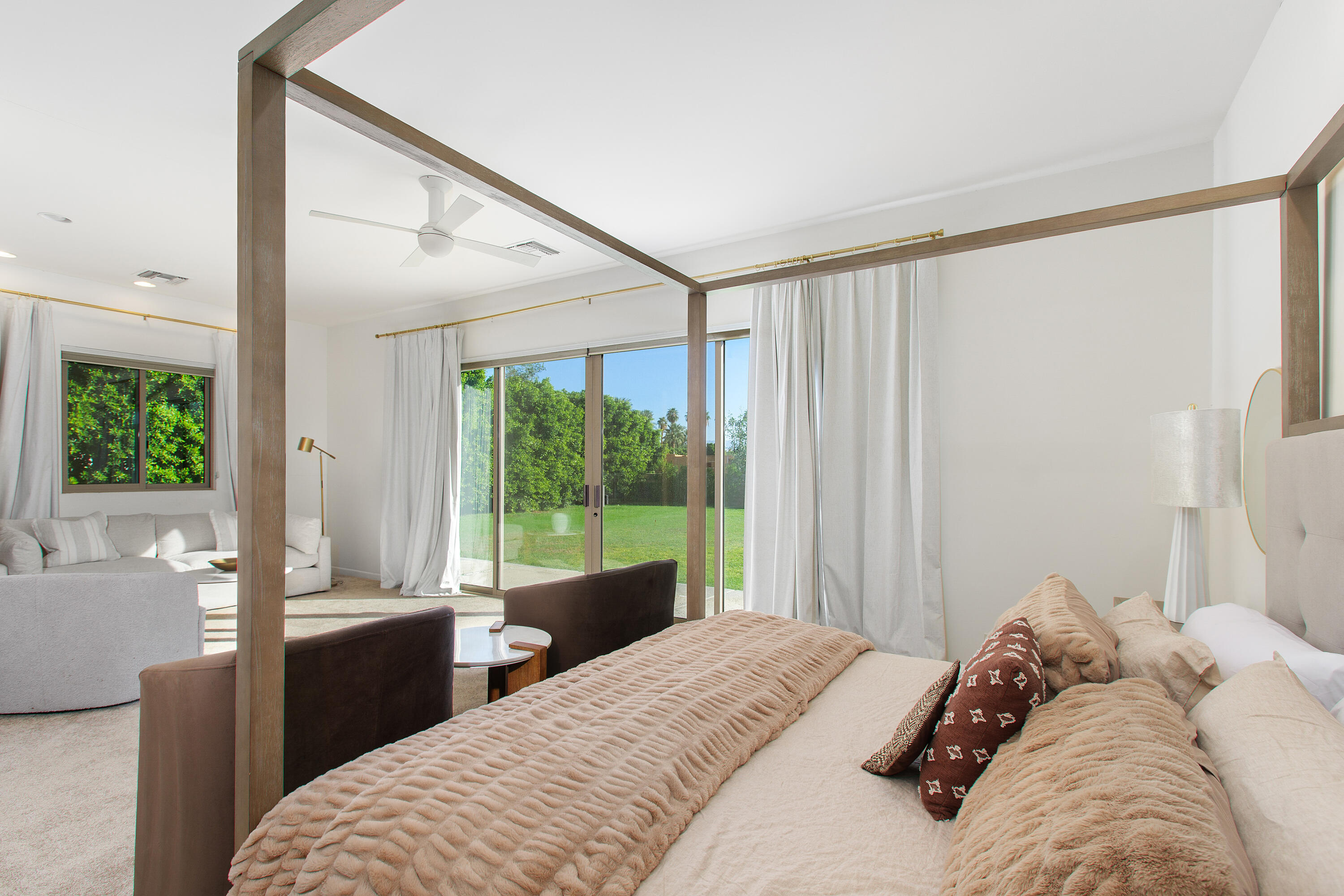 41750 Rancho Manana Lane Rancho Mirage, CA 92270 - Photo 16 of 37 a bedroom with a bed and a large window with outer view