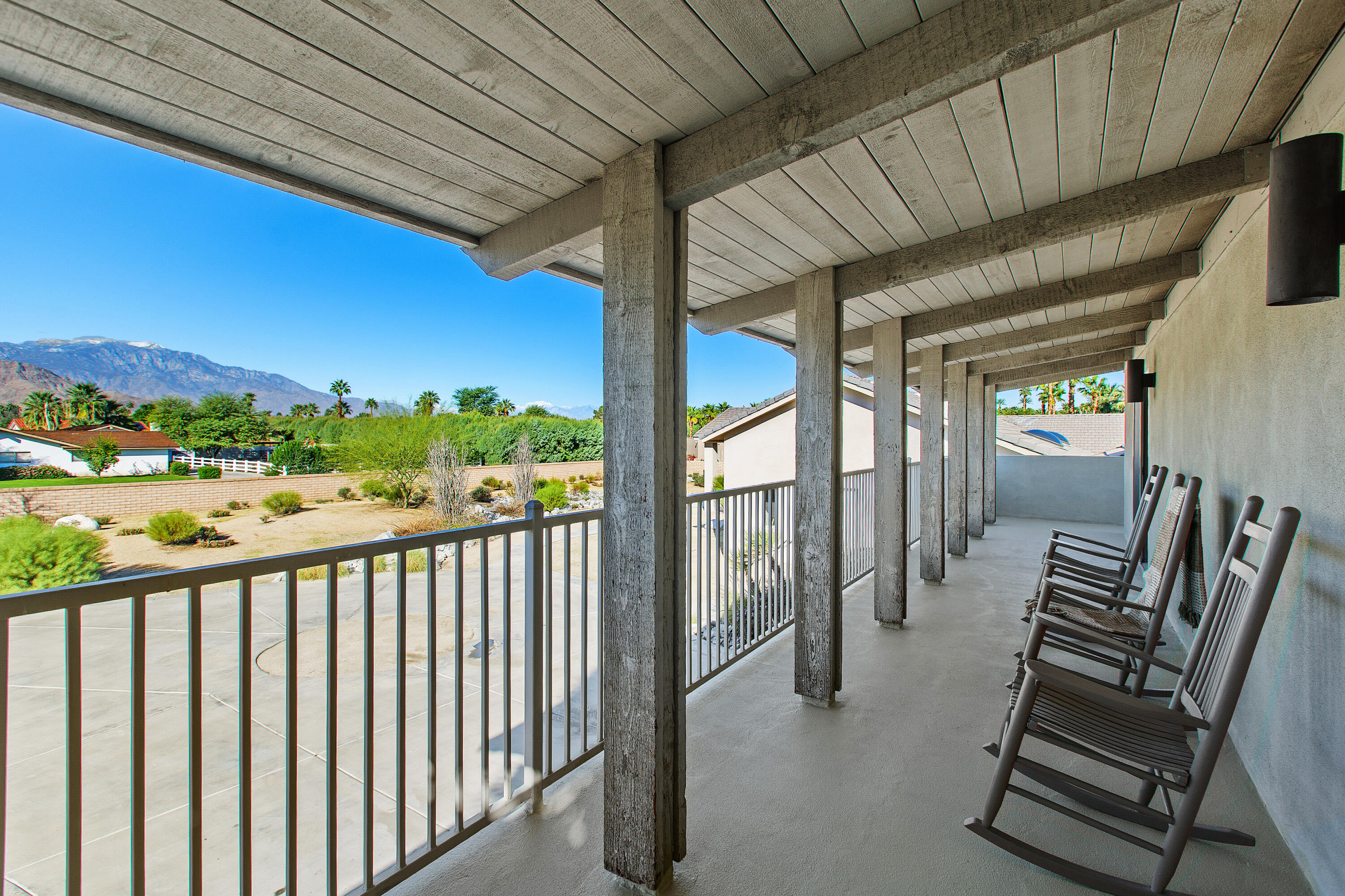 41750 Rancho Manana Lane Rancho Mirage, CA 92270 - Photo 27 of 37 a view of balcony with wooden floor and outdoor seating