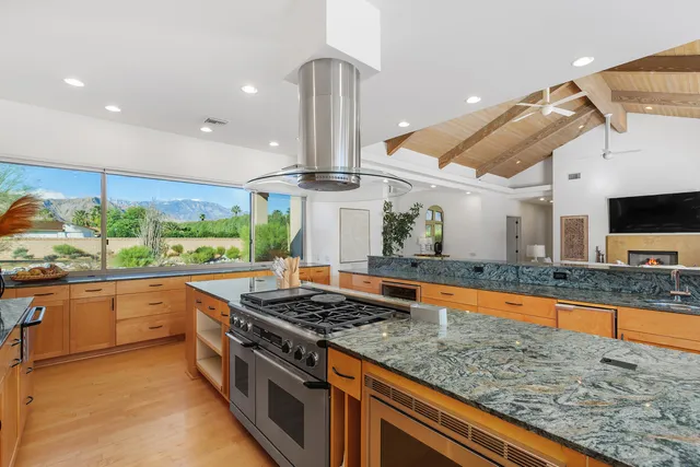 a view of a storage and utility room with washer and dryer