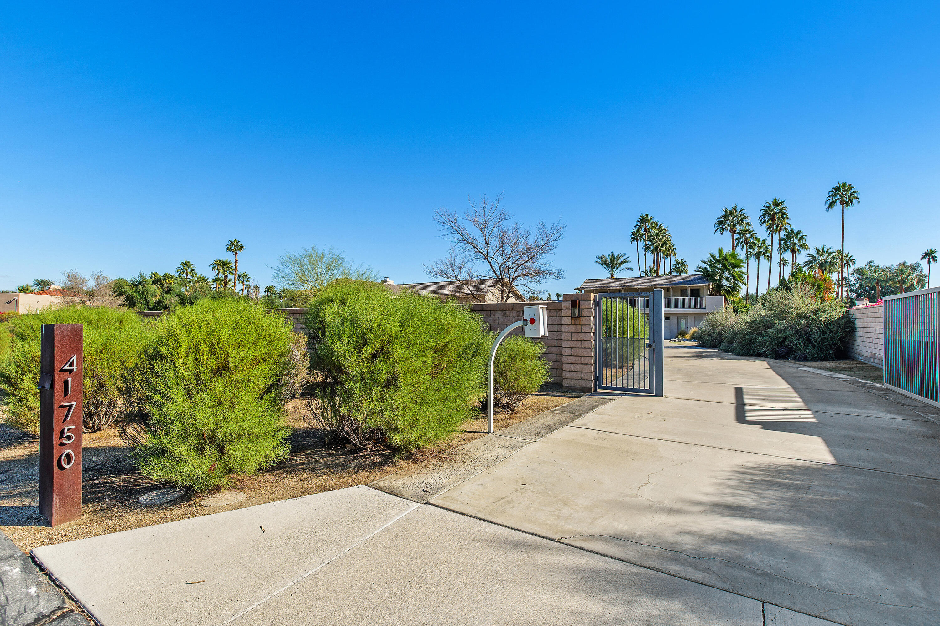 41750 Rancho Manana Lane Rancho Mirage, CA 92270 - Photo 33 of 37 a view of a garden with a bench