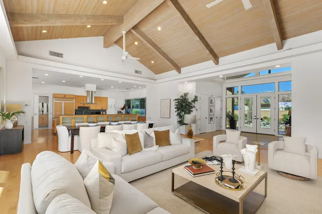 a view of a house with swimming pool and sitting area