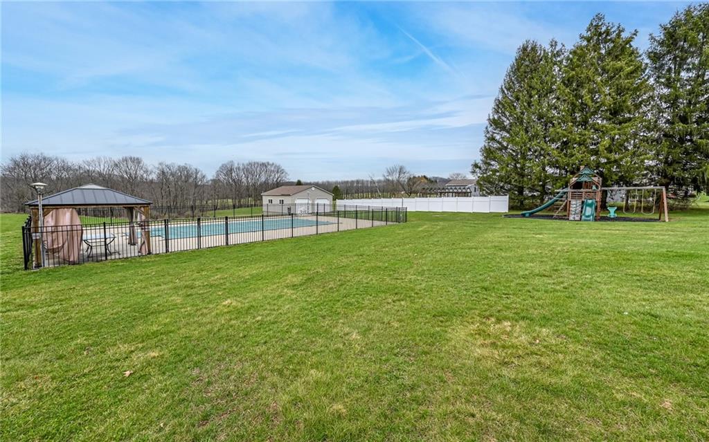 27 Kaufman Road Gibsonia, PA 15044 - Photo 9 of 41 Parklike & Serene ~~ Gazebo is attached to the concrete ~~ Two car garage on the other side of the pool is used for the pool toys ~~ Consider converting it into a true Pool House!!