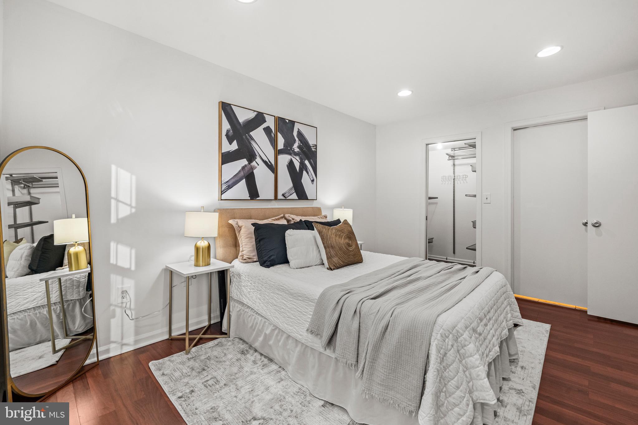 4531 28th Road South, Unit 97 Arlington, VA 22206 - Photo 15 of 32 a bedroom with a bed and a mirror