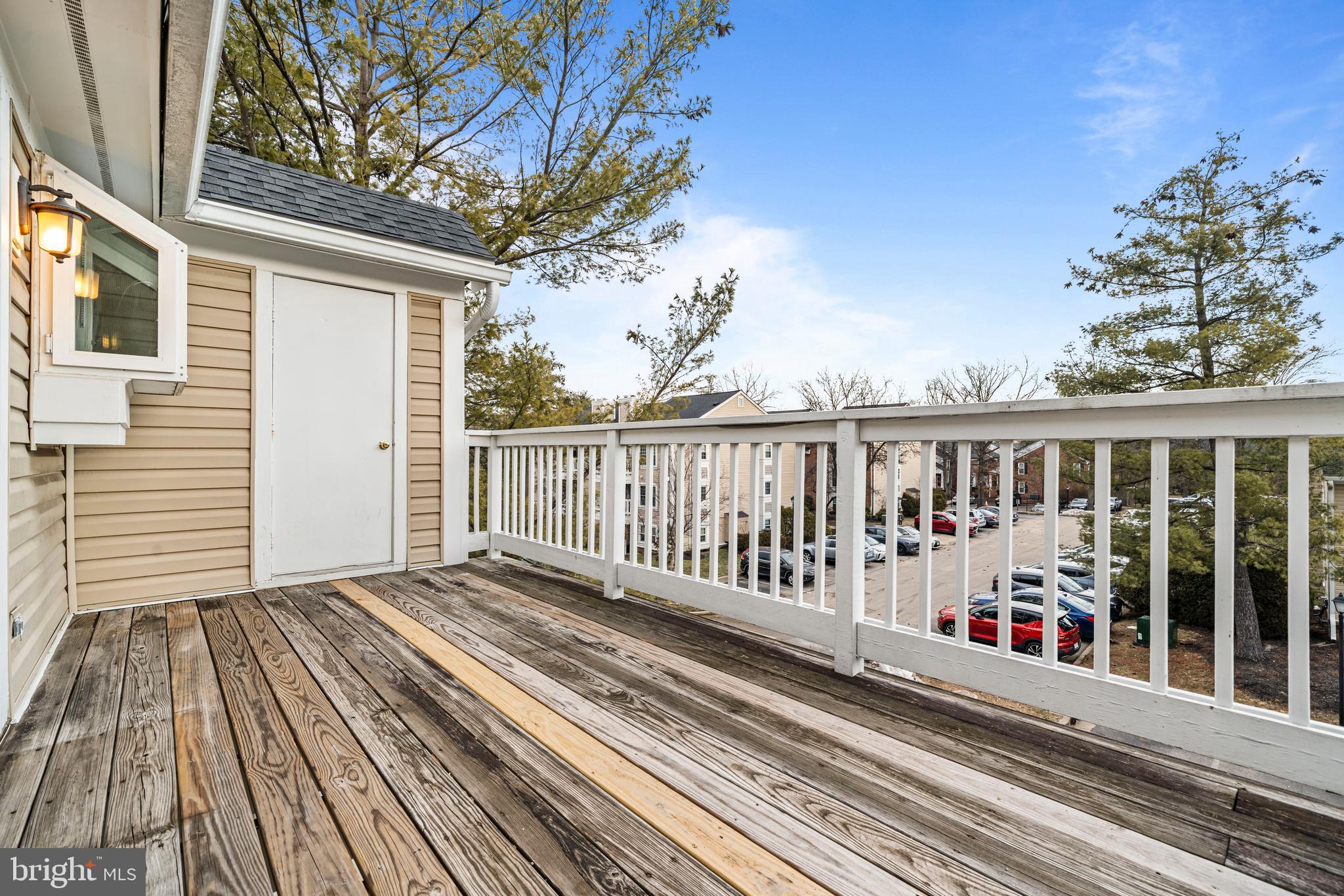 4531 28th Road South, Unit 97 Arlington, VA 22206 - Photo 21 of 32 a view of a wooden balcony with a bench