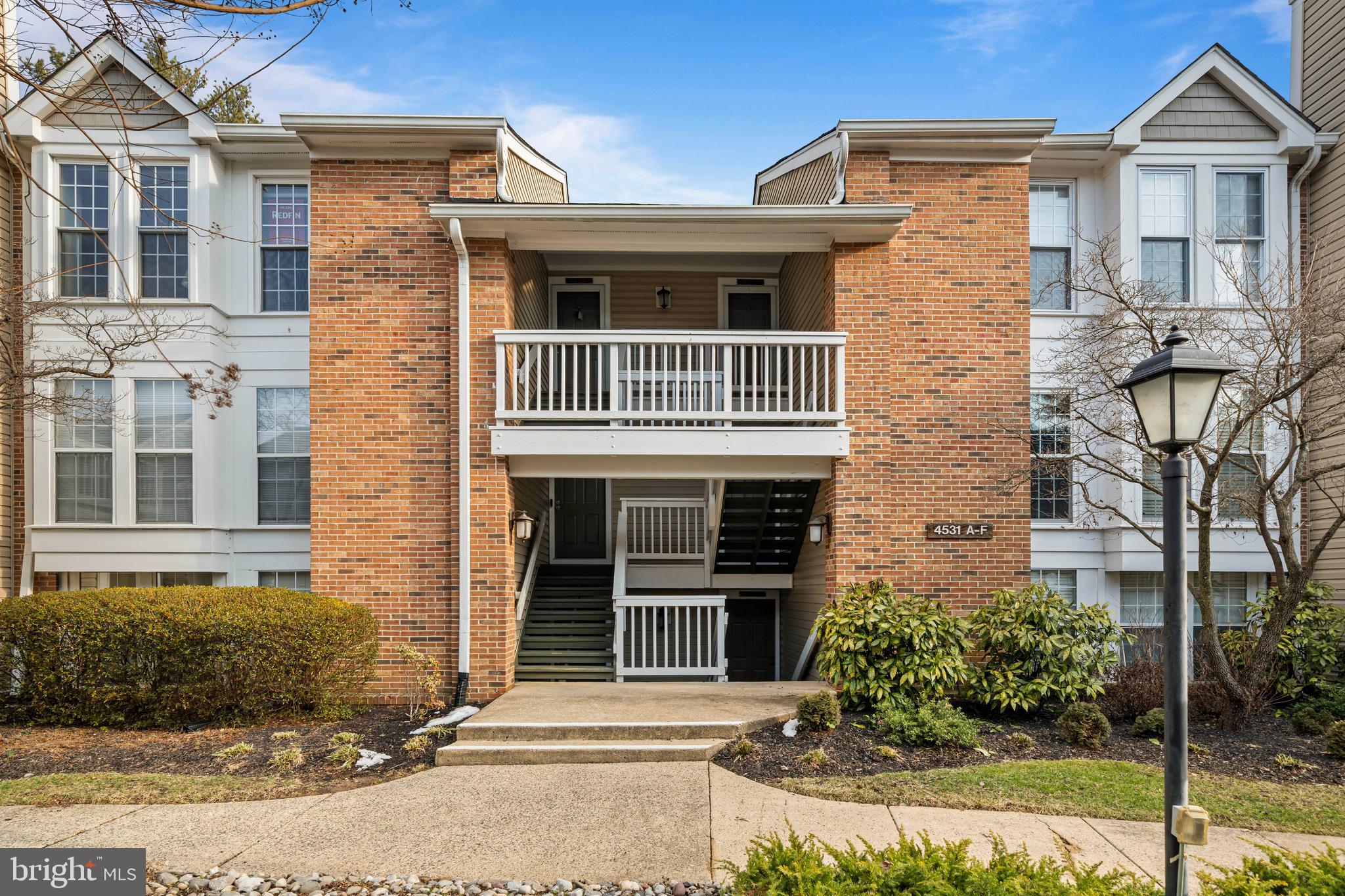 4531 28th Road South, Unit 97 Arlington, VA 22206 - Photo 23 of 32 a view of a brick house with large windows and plants