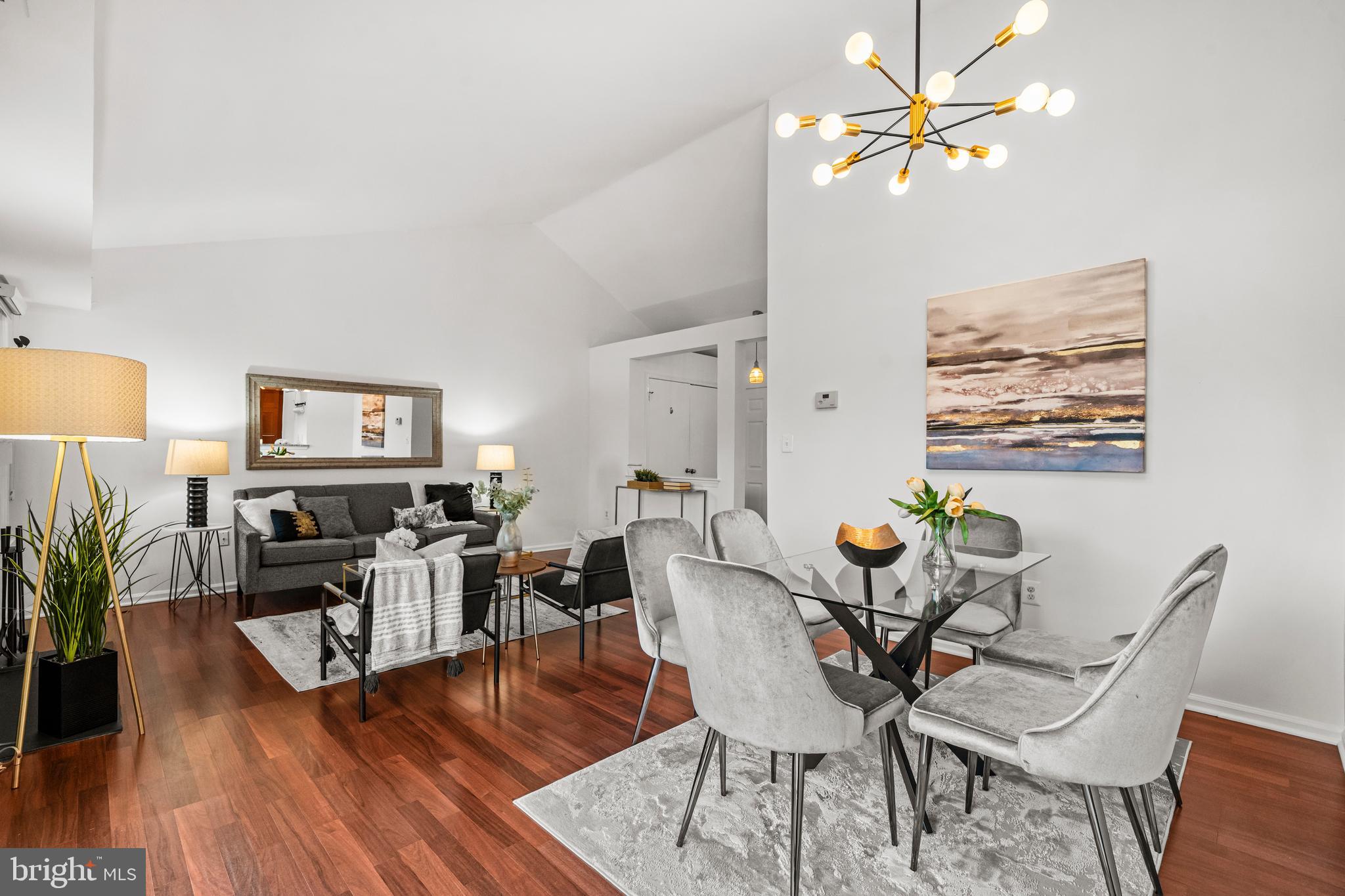 4531 28th Road South, Unit 97 Arlington, VA 22206 - Photo 6 of 32 a dining room with furniture a chandelier and wooden floor