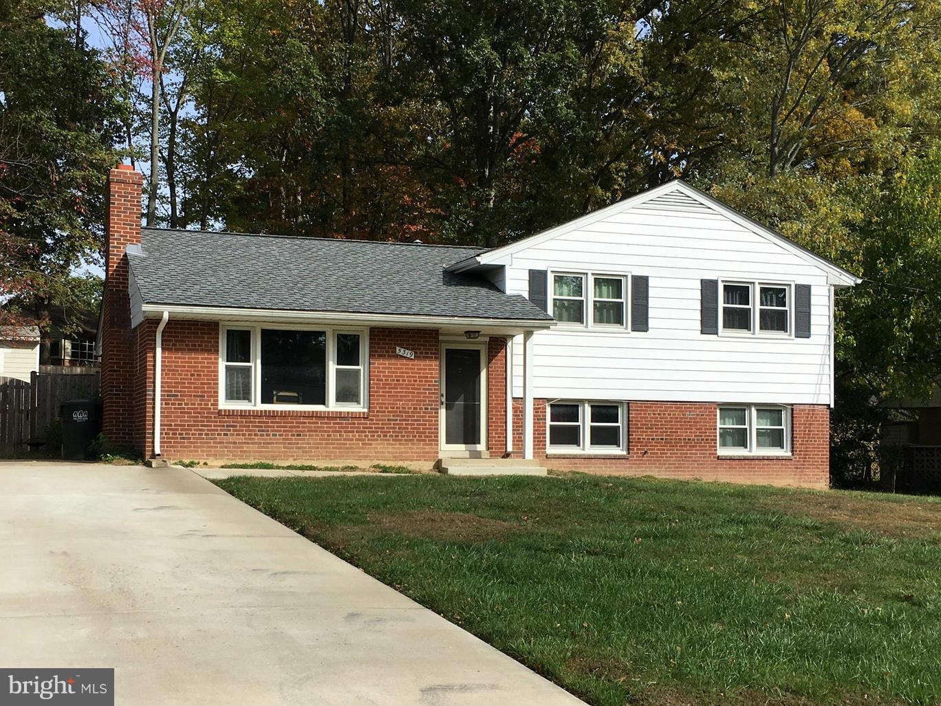 5319 Ravensworth Road Springfield, VA 22151 - Photo 1 of 14 a front view of a house with a garden