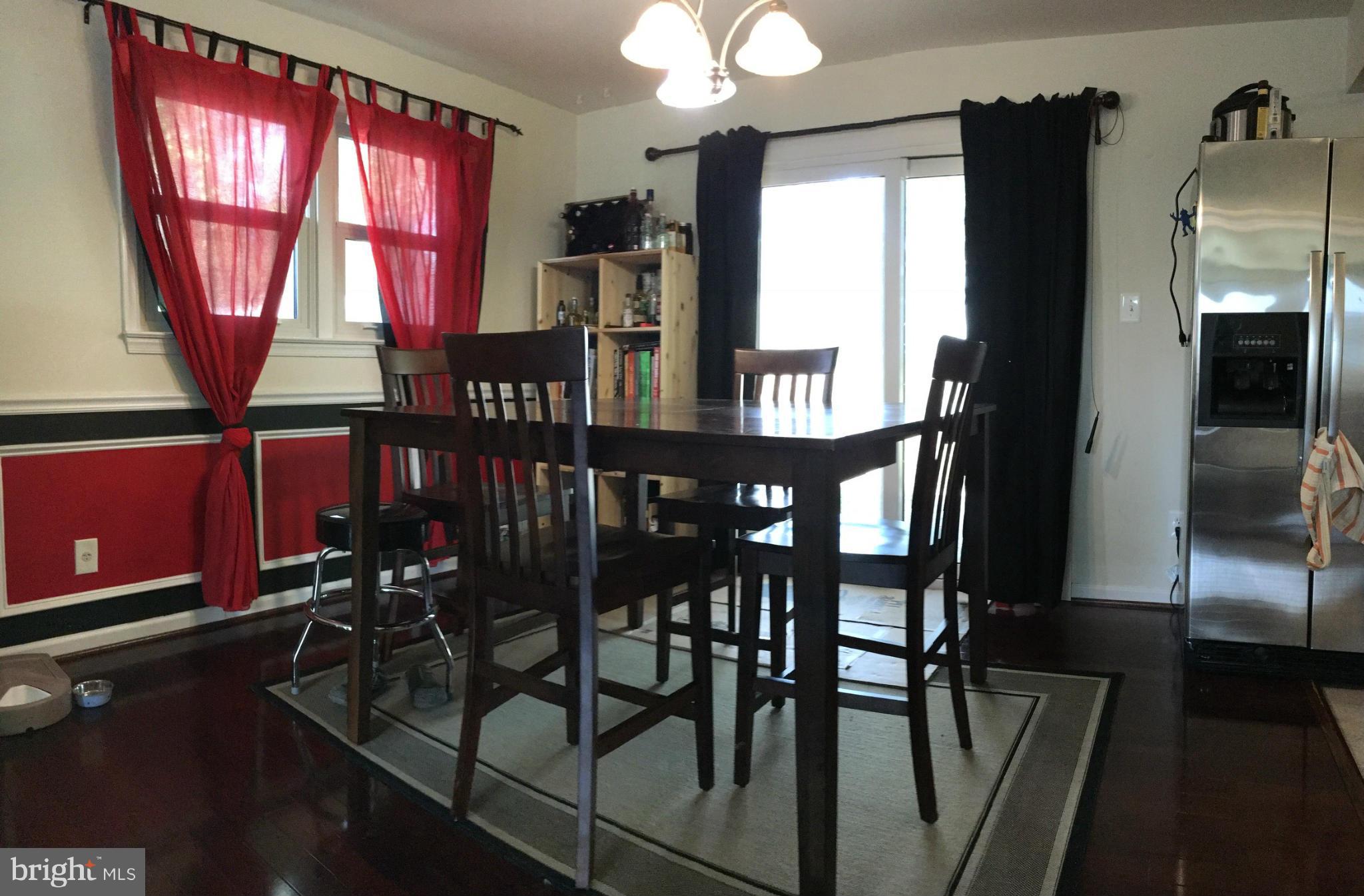 5319 Ravensworth Road Springfield, VA 22151 - Photo 4 of 14 a view of a dining room with furniture and window