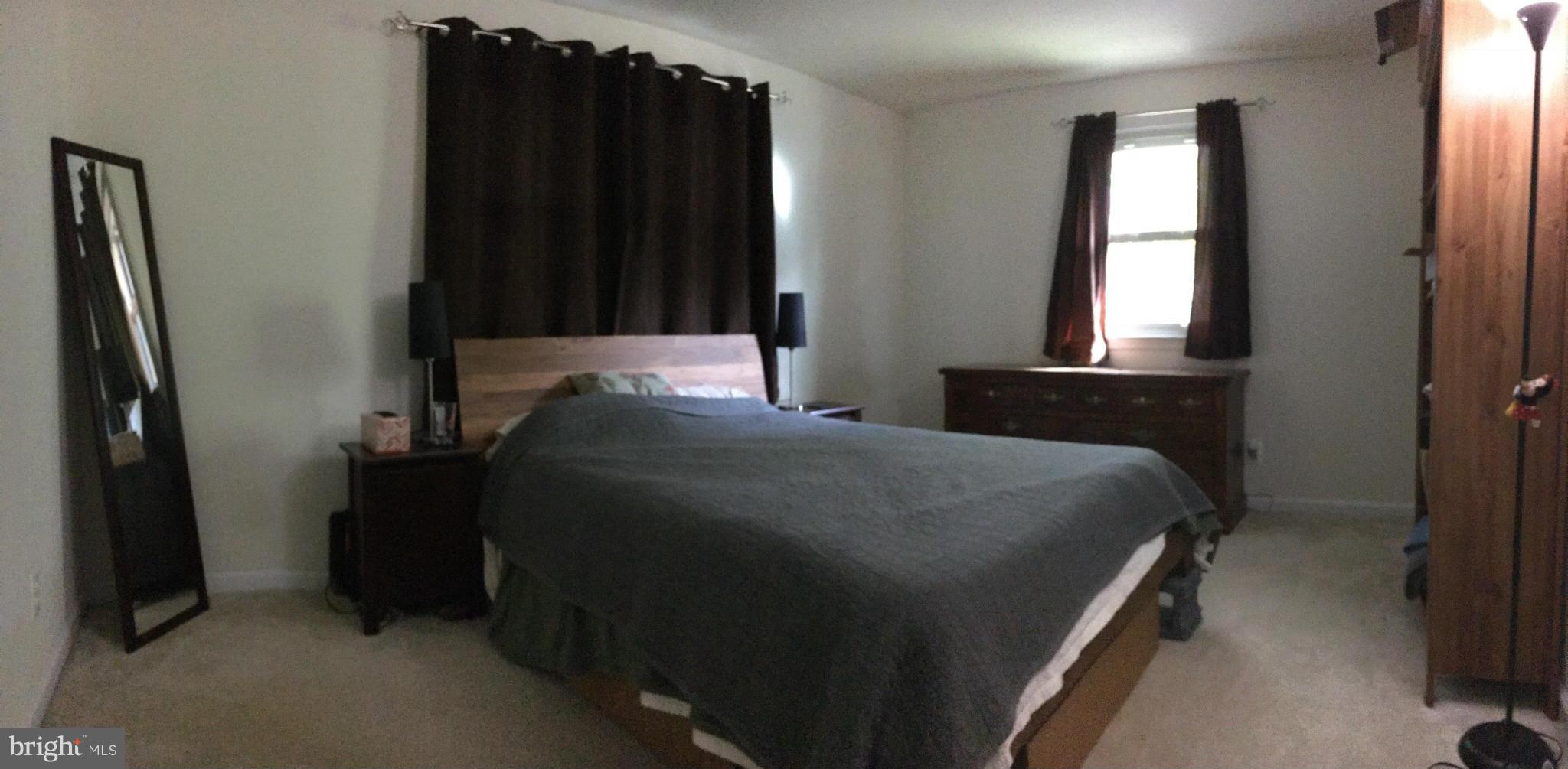 5319 Ravensworth Road Springfield, VA 22151 - Photo 7 of 14 a bedroom with a bed and a window