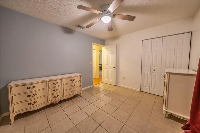 a view of a livingroom with a furniture and a ceiling fan