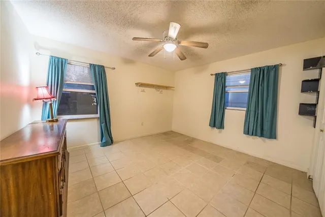 a view of an empty room with a fireplace