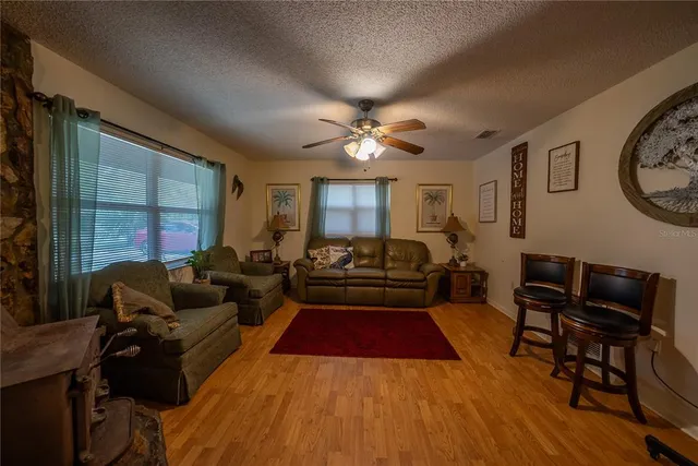 an aerial view of a house with garden space and street view