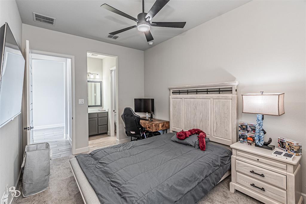 116 Derrett Lane Rhome, TX 76078 - Photo 16 of 30 a bedroom with a bed and a couch