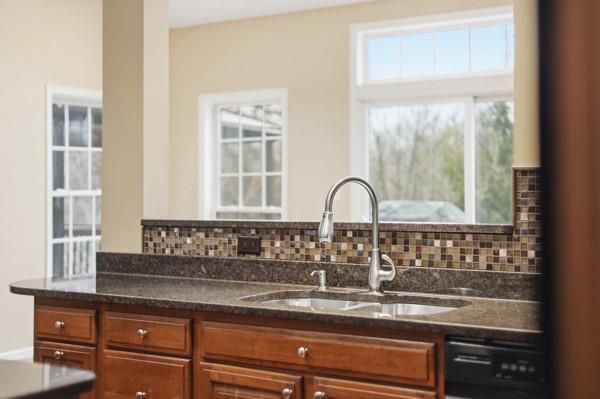 2338 Nicholson Road Sewickley, PA 15143 - Photo 15 of 44 The wall of windows in the sunroom bring light into the kitchen.