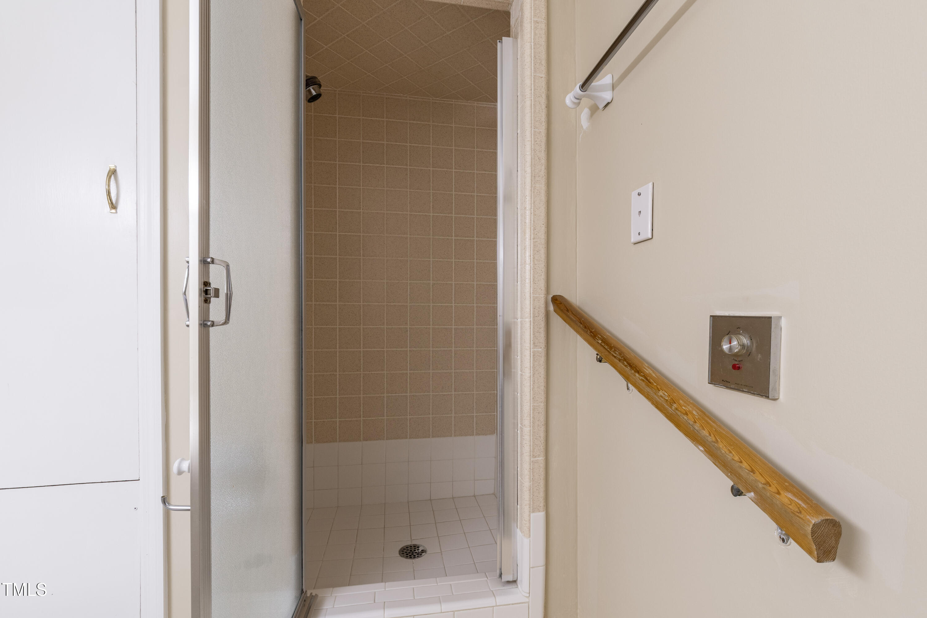 4517 Gates Street Raleigh, NC 27609 - Photo 54 of 66 a bathroom with a shower and a glass door
