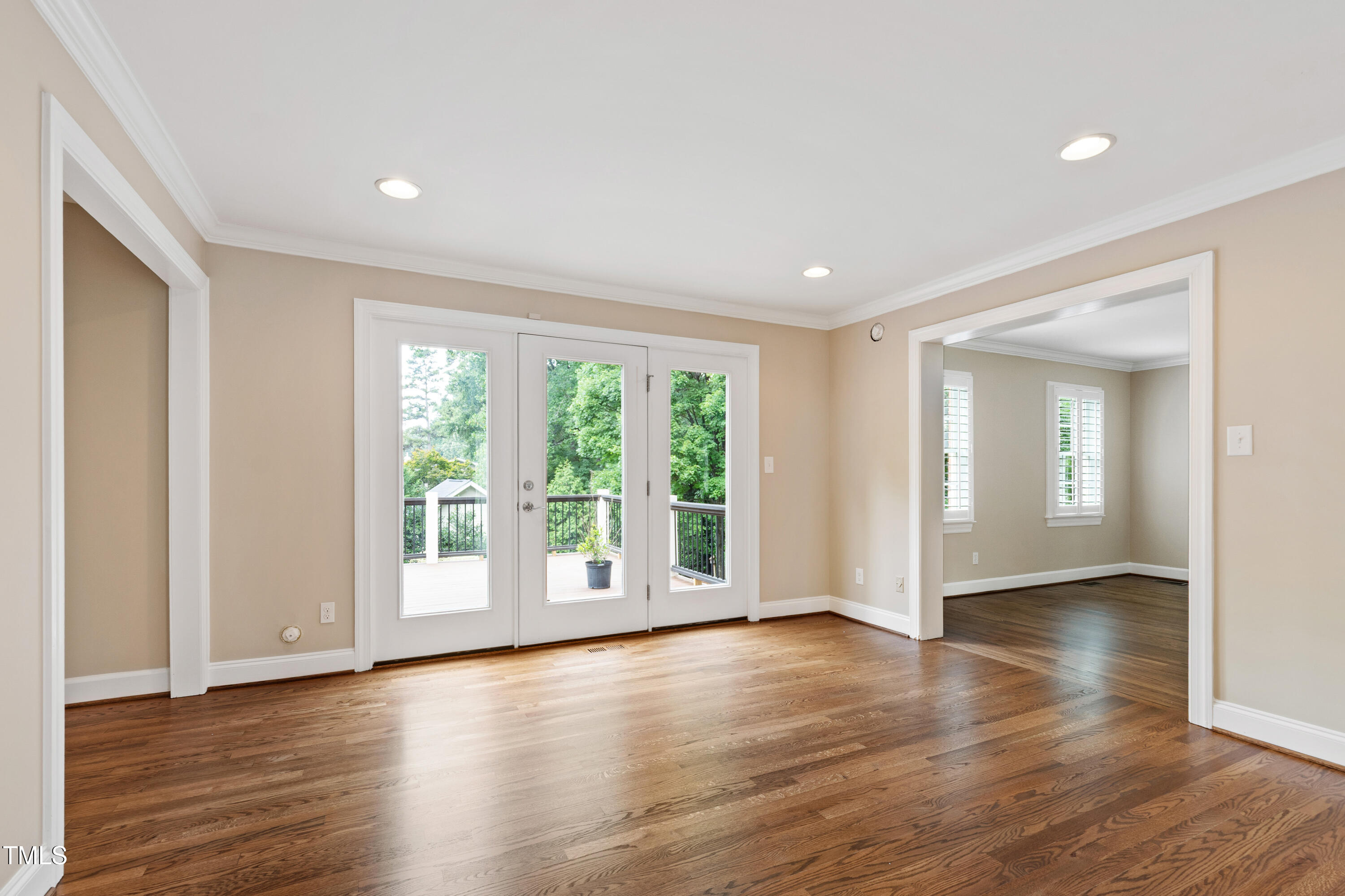 4517 Gates Street Raleigh, NC 27609 - Photo 8 of 66 a view of an empty room with wooden floor and a window