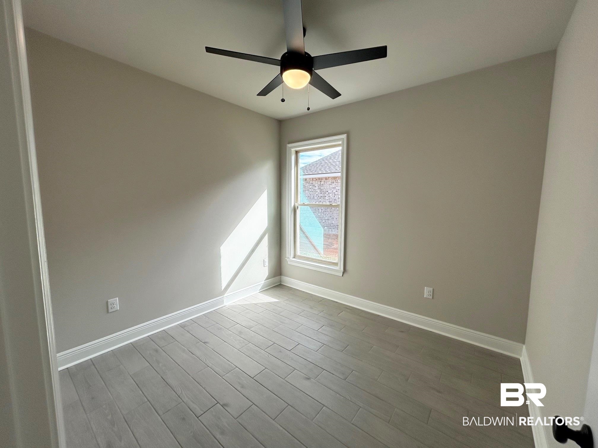 881 Sumter Loop Foley, AL 36535 - Photo 11 of 19 Spare room featuring ceiling fan and light wood-type flooring