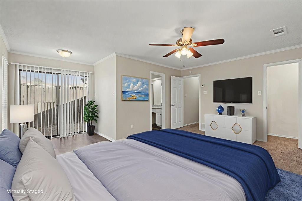 124 Summit Cove Trophy Club, TX 76262 - Photo 11 of 23 a bedroom with a large bed and a flat screen tv