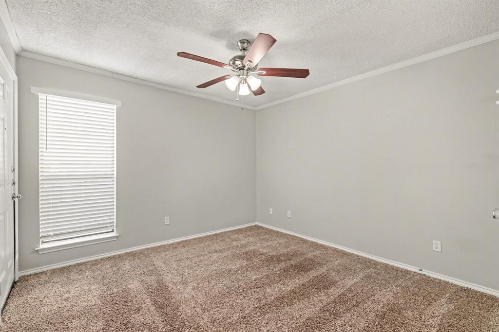 124 Summit Cove Trophy Club, TX 76262 - Photo 15 of 23 an empty room with a window and a fan