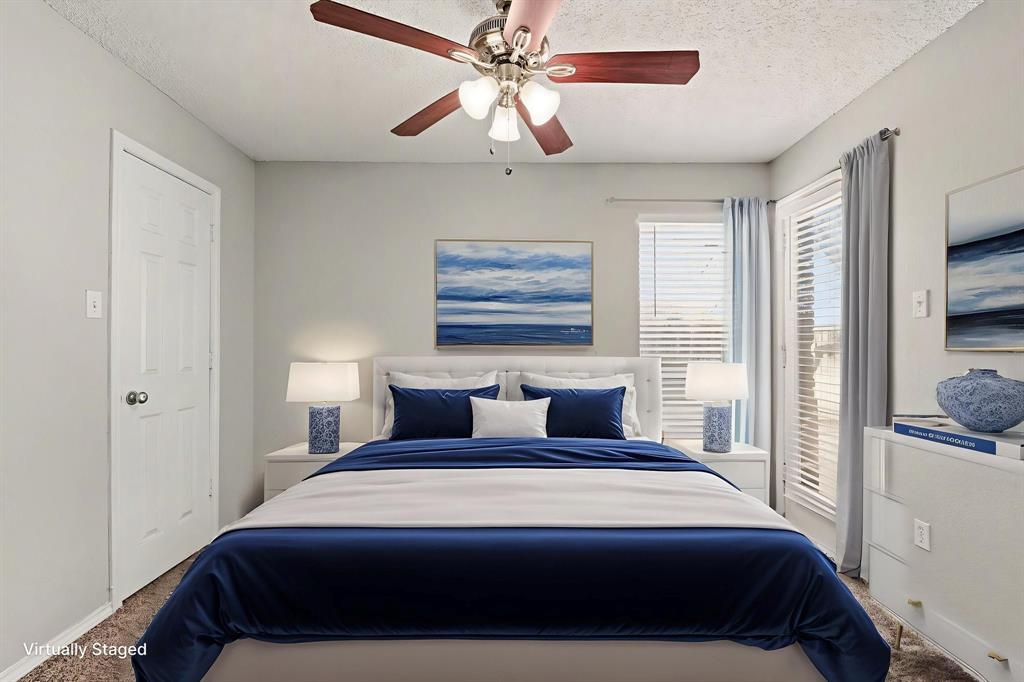 124 Summit Cove Trophy Club, TX 76262 - Photo 17 of 23 a bedroom with a bed and a painting on the wall