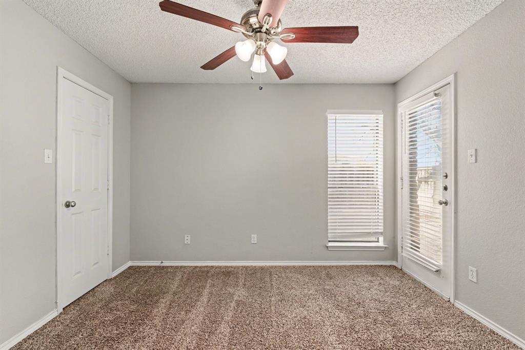 124 Summit Cove Trophy Club, TX 76262 - Photo 18 of 23 an empty room with windows and fan