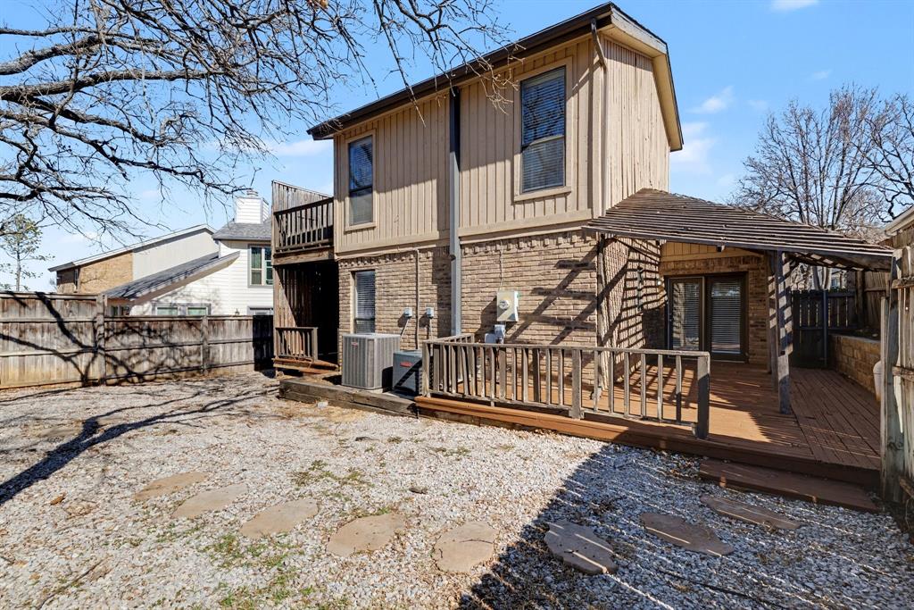 124 Summit Cove Trophy Club, TX 76262 - Photo 20 of 23 a view of a house with wooden fence