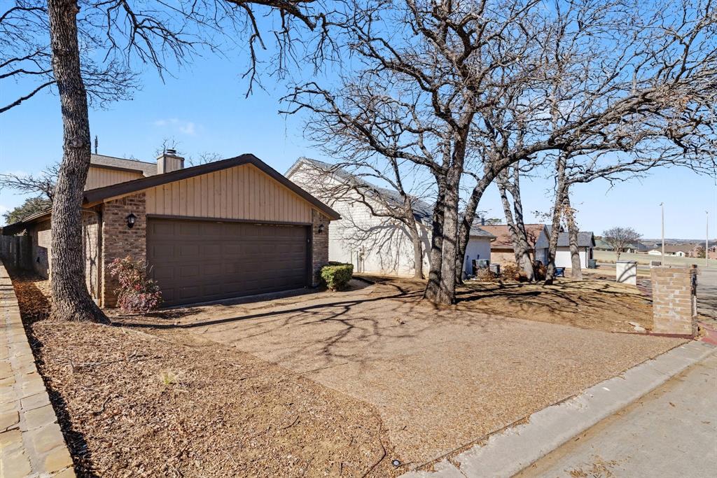 124 Summit Cove Trophy Club, TX 76262 - Photo 2 of 23 a view of outdoor space and yard