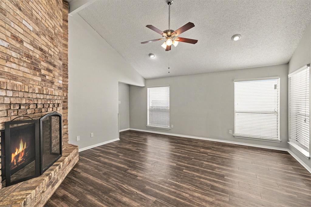 124 Summit Cove Trophy Club, TX 76262 - Photo 5 of 23 a view of an empty room with a fireplace and a window