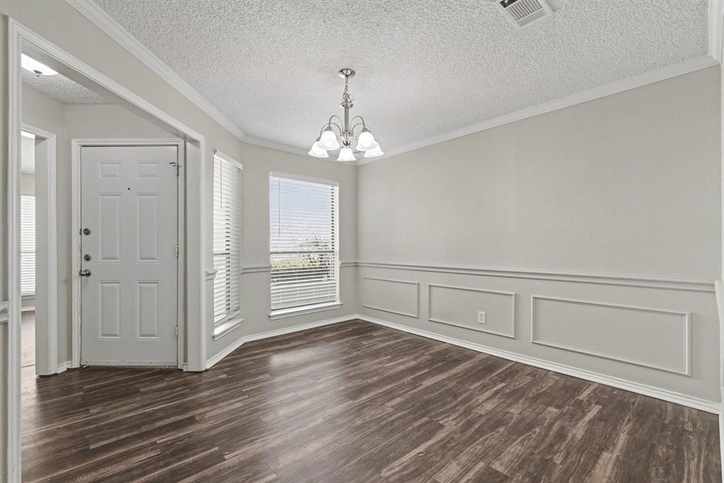 124 Summit Cove Trophy Club, TX 76262 - Photo 6 of 23 a view of an empty room with wooden floor