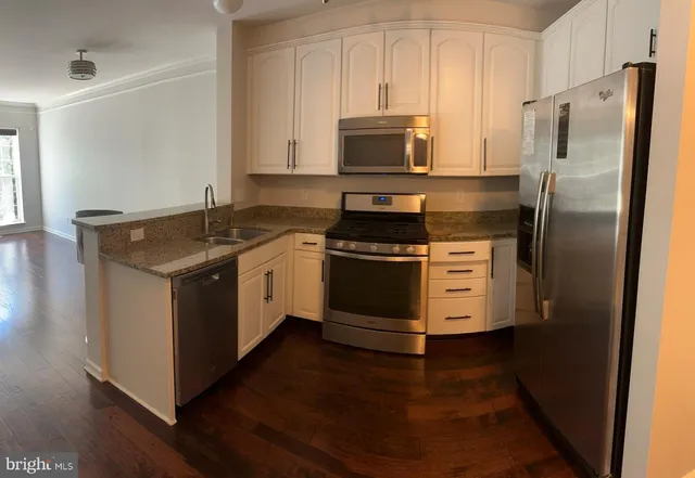 a kitchen with a stove microwave and refrigerator