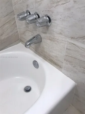 a bathroom with a sink and toilet