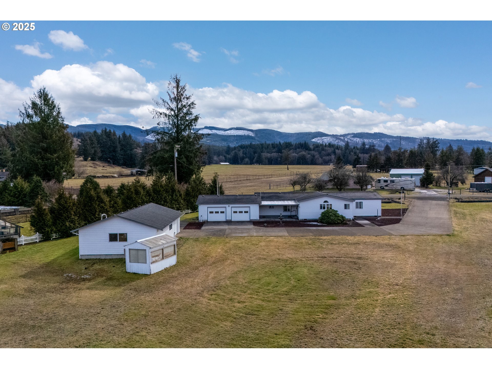 9776 South Prairie Road Tillamook, OR 97141 - Photo 1 of 38 a view of a swimming pool and lounge chairs