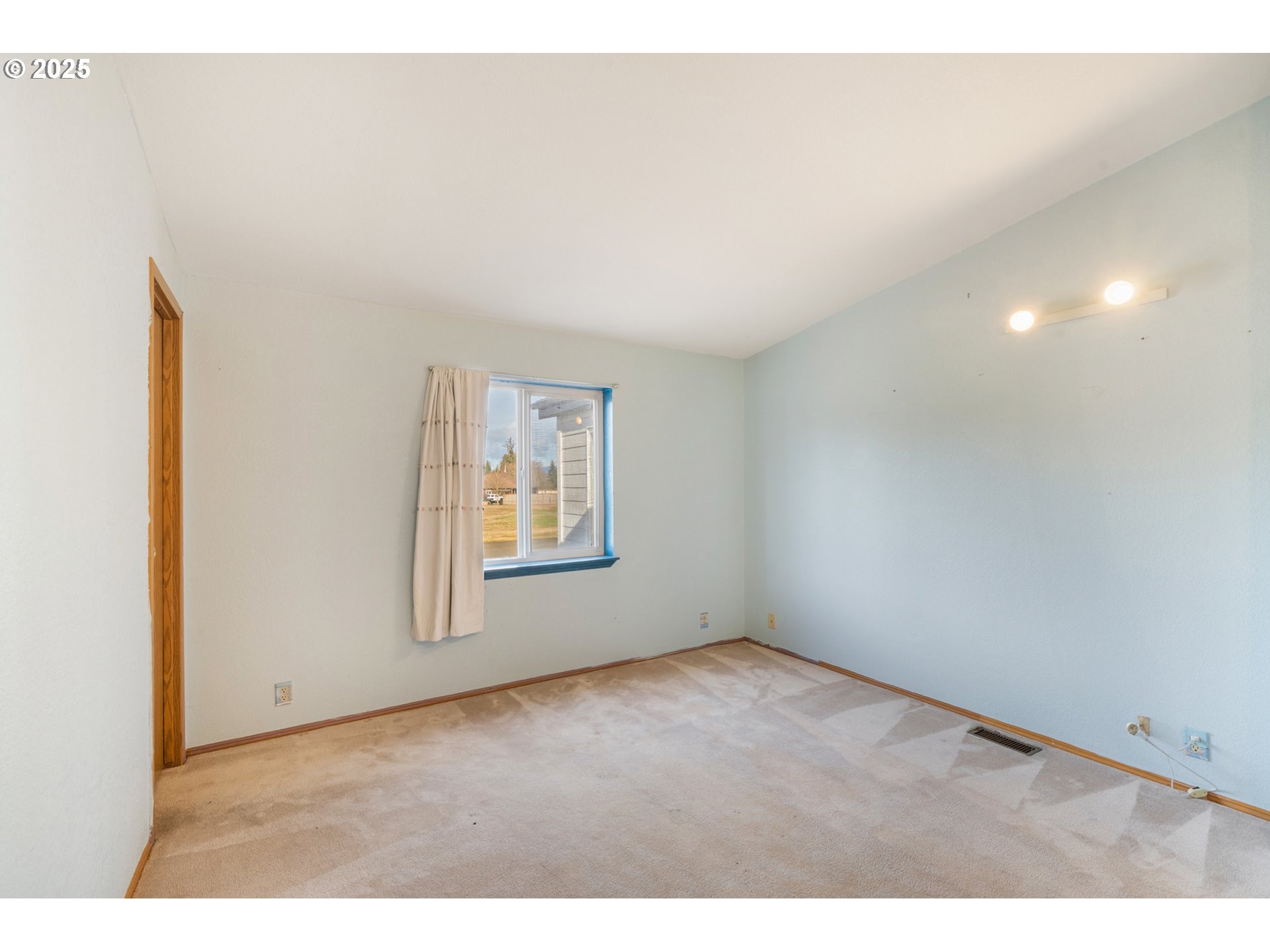 9776 South Prairie Road Tillamook, OR 97141 - Photo 20 of 38 a view of an empty room with a window