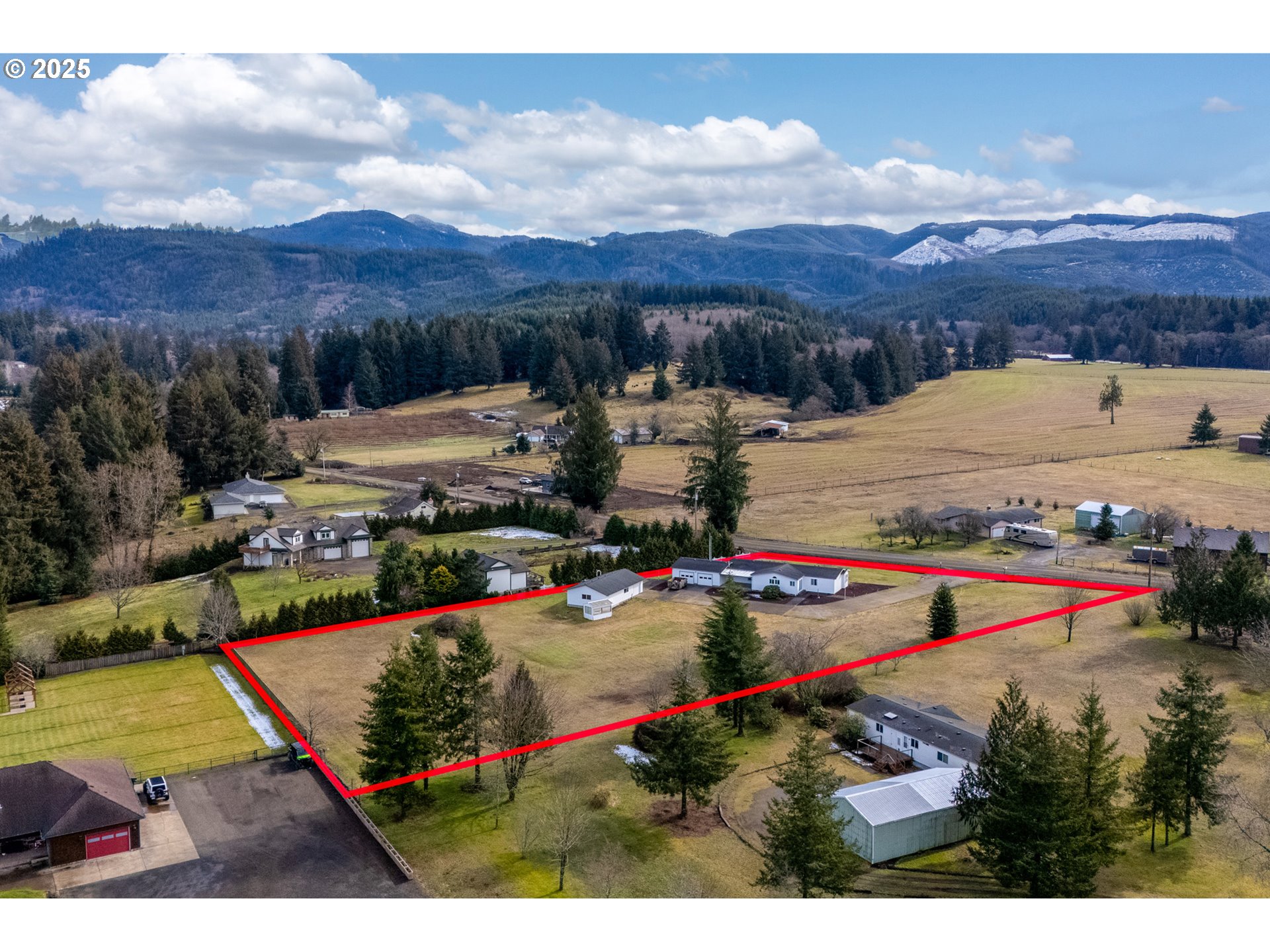9776 South Prairie Road Tillamook, OR 97141 - Photo 2 of 38 a view of a houses with swimming pool