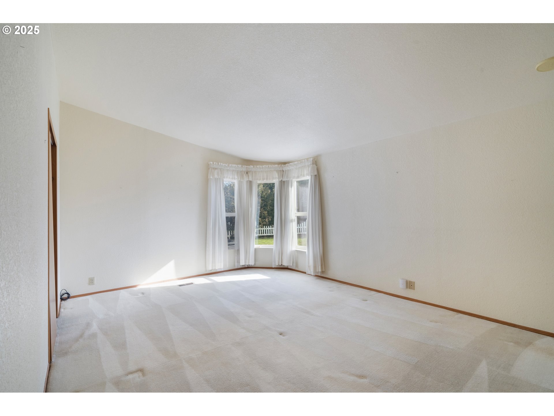 9776 South Prairie Road Tillamook, OR 97141 - Photo 23 of 38 a view of an empty room with wooden floor