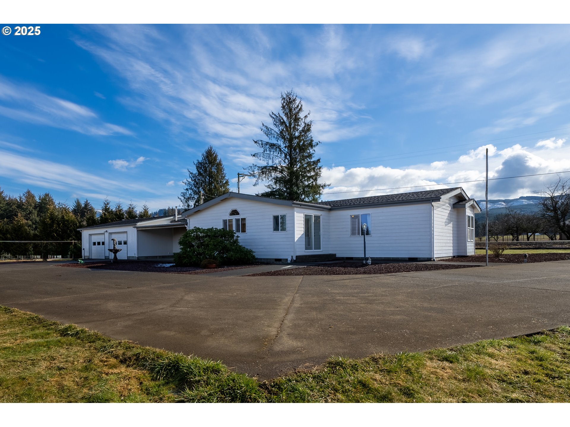 9776 South Prairie Road Tillamook, OR 97141 - Photo 3 of 38 a view of a house with a yard