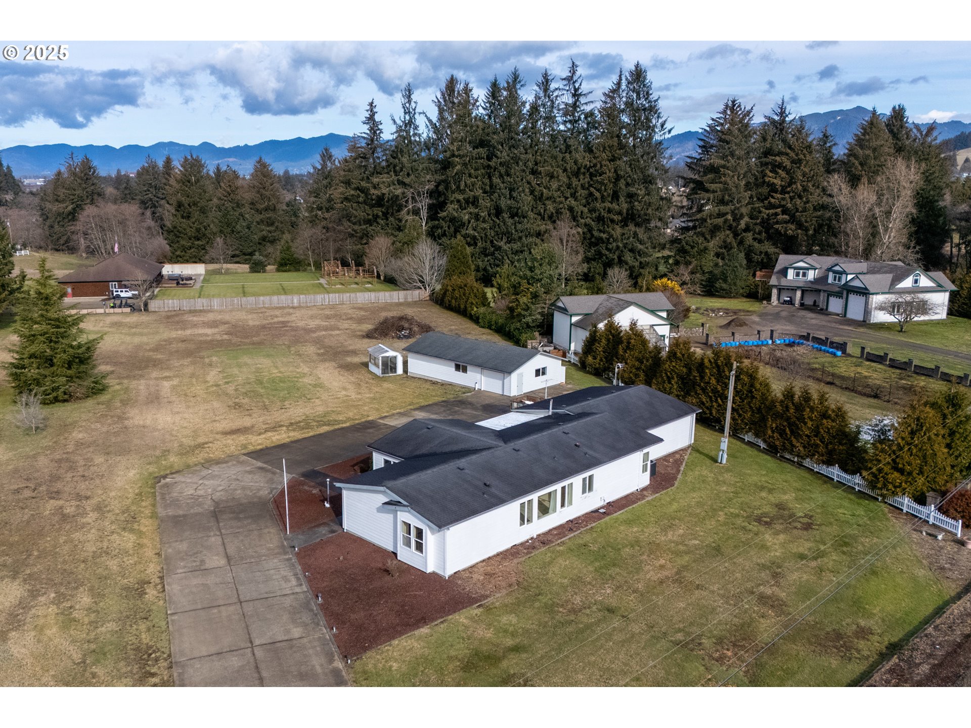 9776 South Prairie Road Tillamook, OR 97141 - Photo 34 of 38 a view of a backyard with a barn