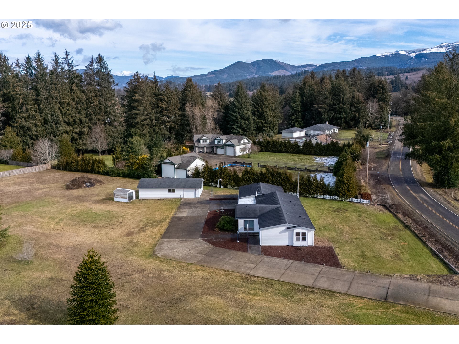 9776 South Prairie Road Tillamook, OR 97141 - Photo 35 of 38 a view of a swimming pool with a table and chairs