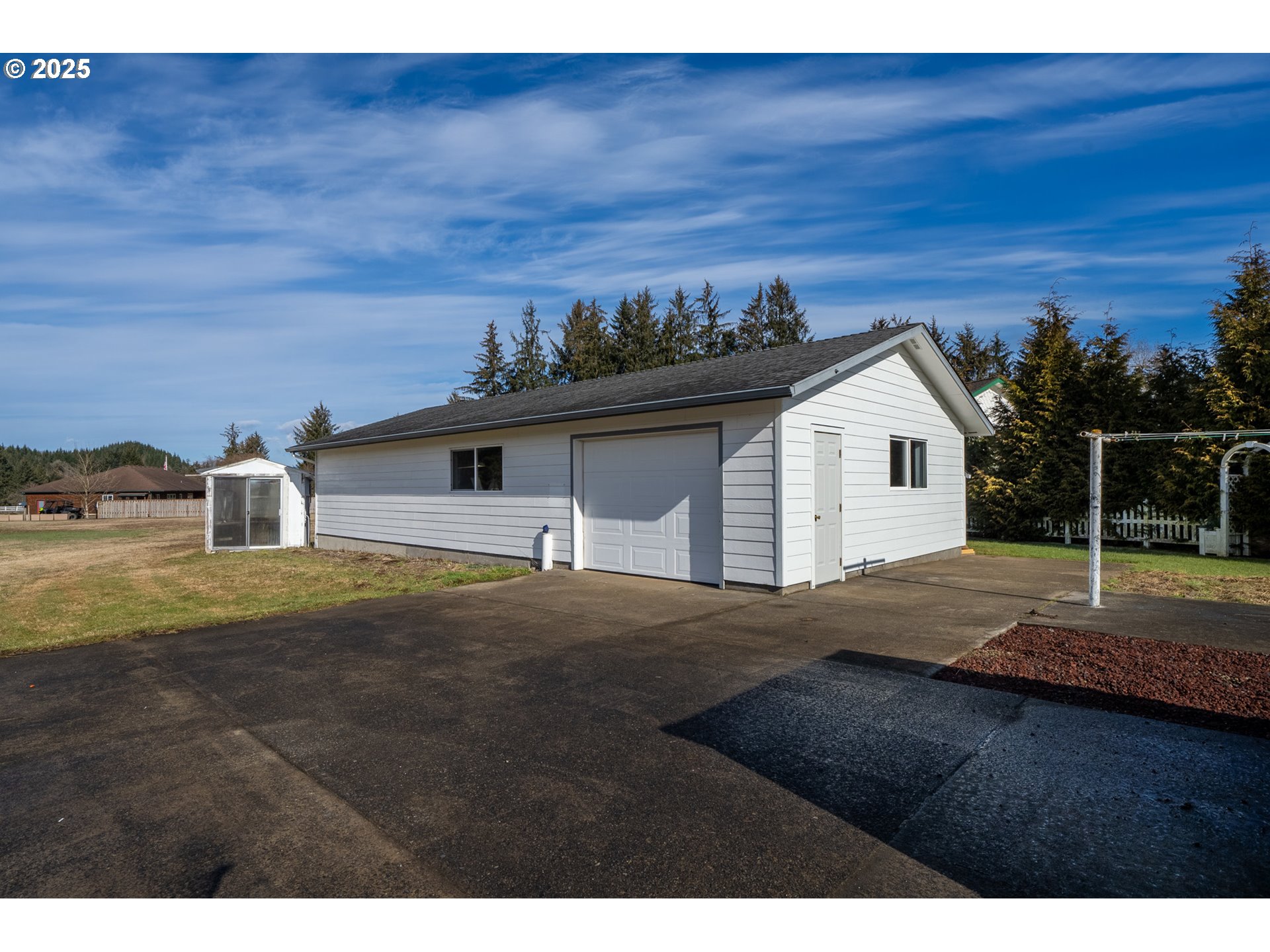 9776 South Prairie Road Tillamook, OR 97141 - Photo 4 of 38 a view of a house with a yard