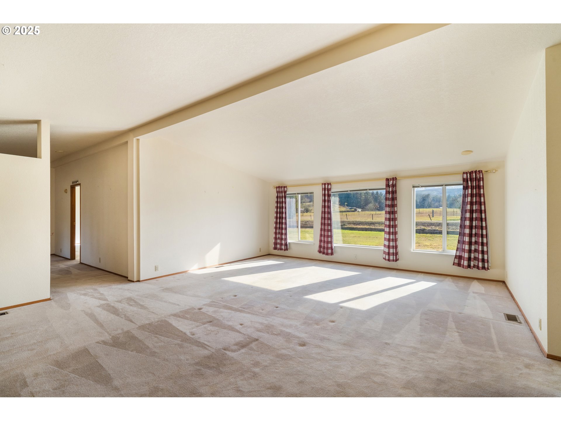 9776 South Prairie Road Tillamook, OR 97141 - Photo 6 of 38 a view of an empty room with a window