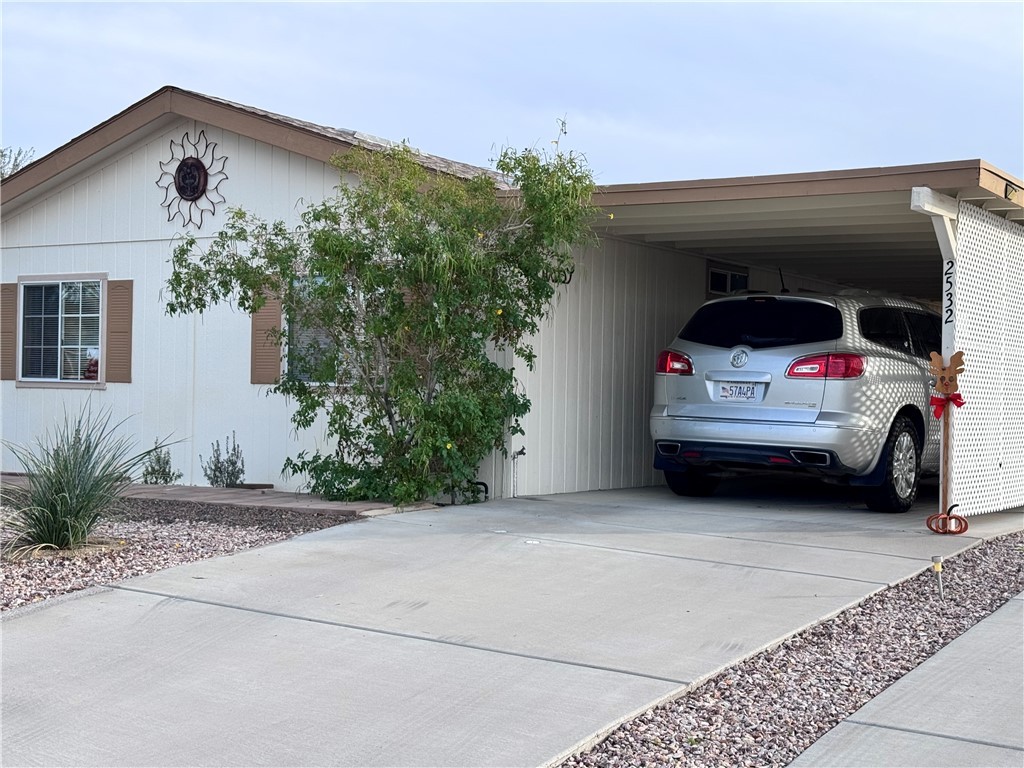 2532 Morgan Road Fort Mohave, AZ 86426 - Photo 4 of 29 View of property exterior with driveway and an attached carport
