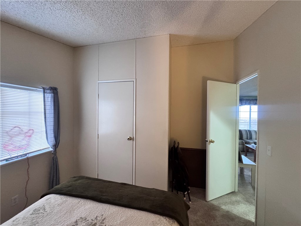 2532 Morgan Road Fort Mohave, AZ 86426 - Photo 10 of 29 Bedroom featuring carpet and a textured ceiling