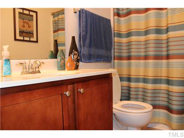 2545 Spring Oaks Way Raleigh, NC 27614 - Photo 12 of 12 Bathroom on second floor with maple cabinets and single vanity.