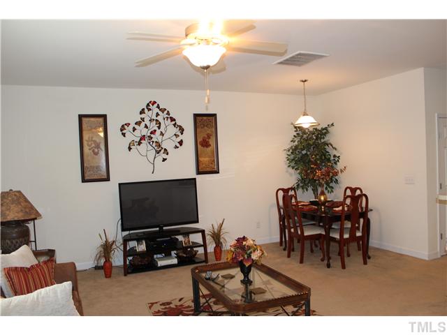 2545 Spring Oaks Way Raleigh, NC 27614 - Photo 3 of 12 Spacious living room open to kitchen with dining area and ceiling fan